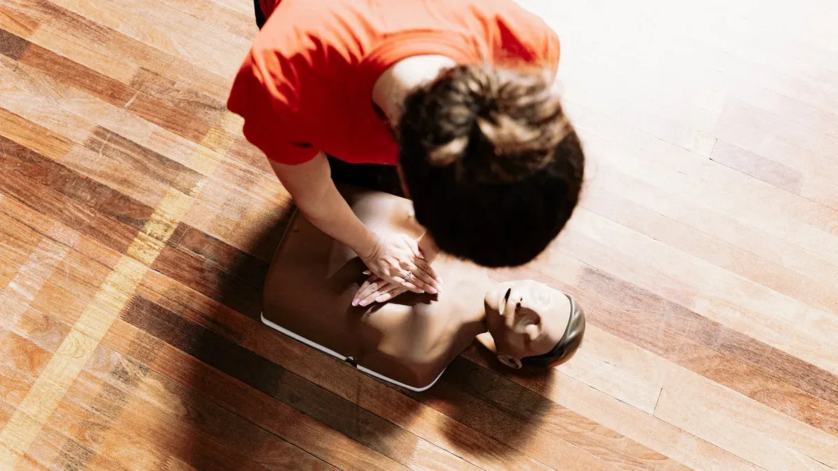 Students practising CPR on training mannequins during an SHSM compulsory certification workshop