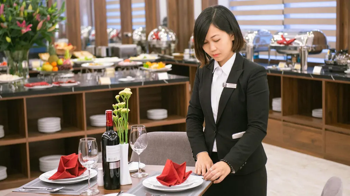 Service team setting tables at a Toronto hotel banquet hall
