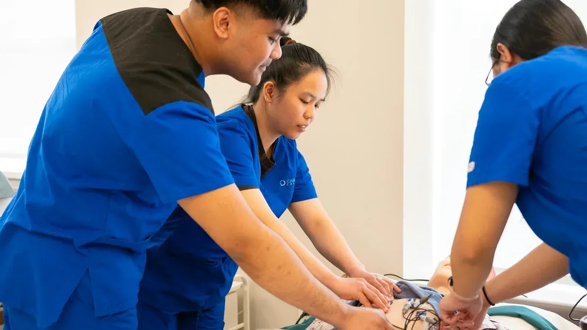 Health and Wellness SHSM students training with medical simulation equipment